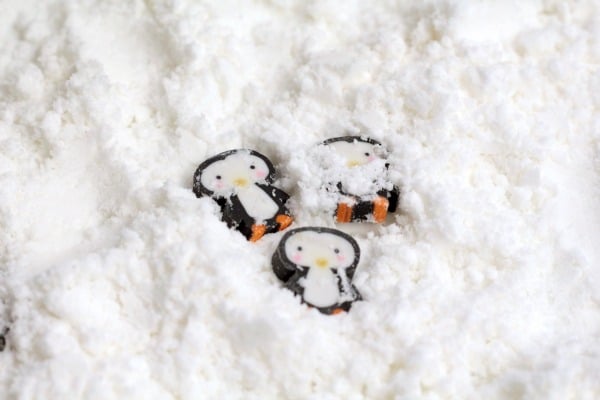 Preschoolers will love these fun penguin preschool activities playing hide and seek with penguins in fake snow. Sensory play and learning!