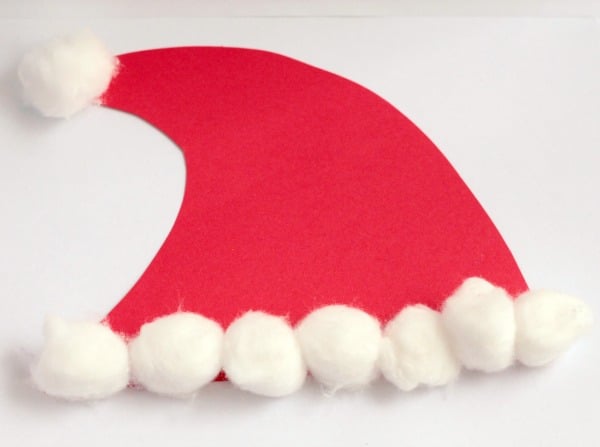 Kids will love this Santa hat craft where they make Santa face masks they can wear all Christmas vacation! This craft is so easy, kids can do it alone!