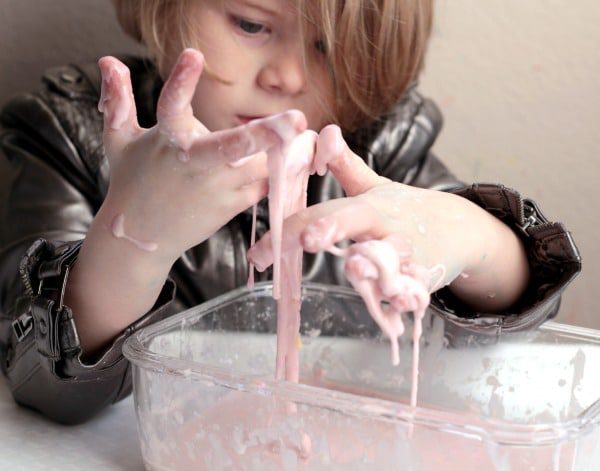 Valentine's Day is filled with fun and science when you make this easy oobleck recipe using conversation hearts! Kids will love making this!
