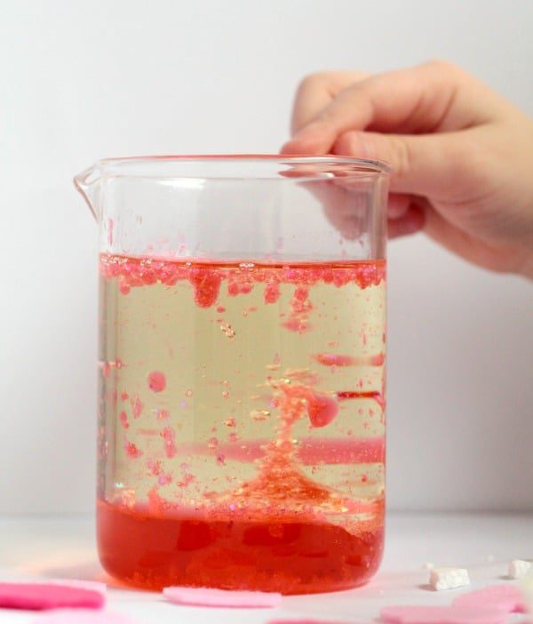 Learn about science this Valentine's Day with this fun Valentine's themed lava lamp science experiment! Kids will have a blast with this!