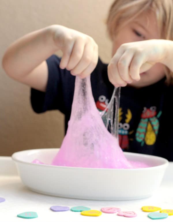Nothing says Valentine's Day like pink and glitter. Mix them both in this fun Valentine's STEM activity making pink glitter slime!
