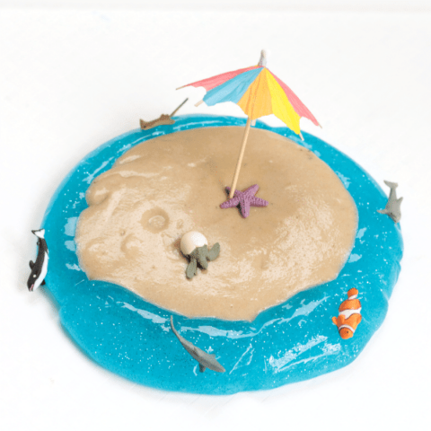 Transform ordinary sand slime into a thing of wonder with this beach sand slime recipe! Kids will love playing with this slime made with laundry starch.