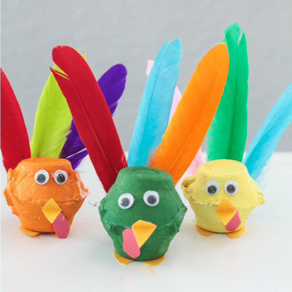 Get crafty when you make these egg carton turkeys using real feathers! The egg carton turkey craft is the perfect Thanksgiving activity for kids!