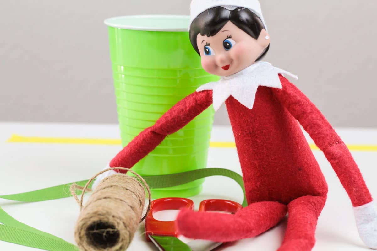 Mix Elf on the Shelf activities with STEM activities for kids in this fun Elf on the Shelf zip line STEM challenge! the elf has to travel somehow!