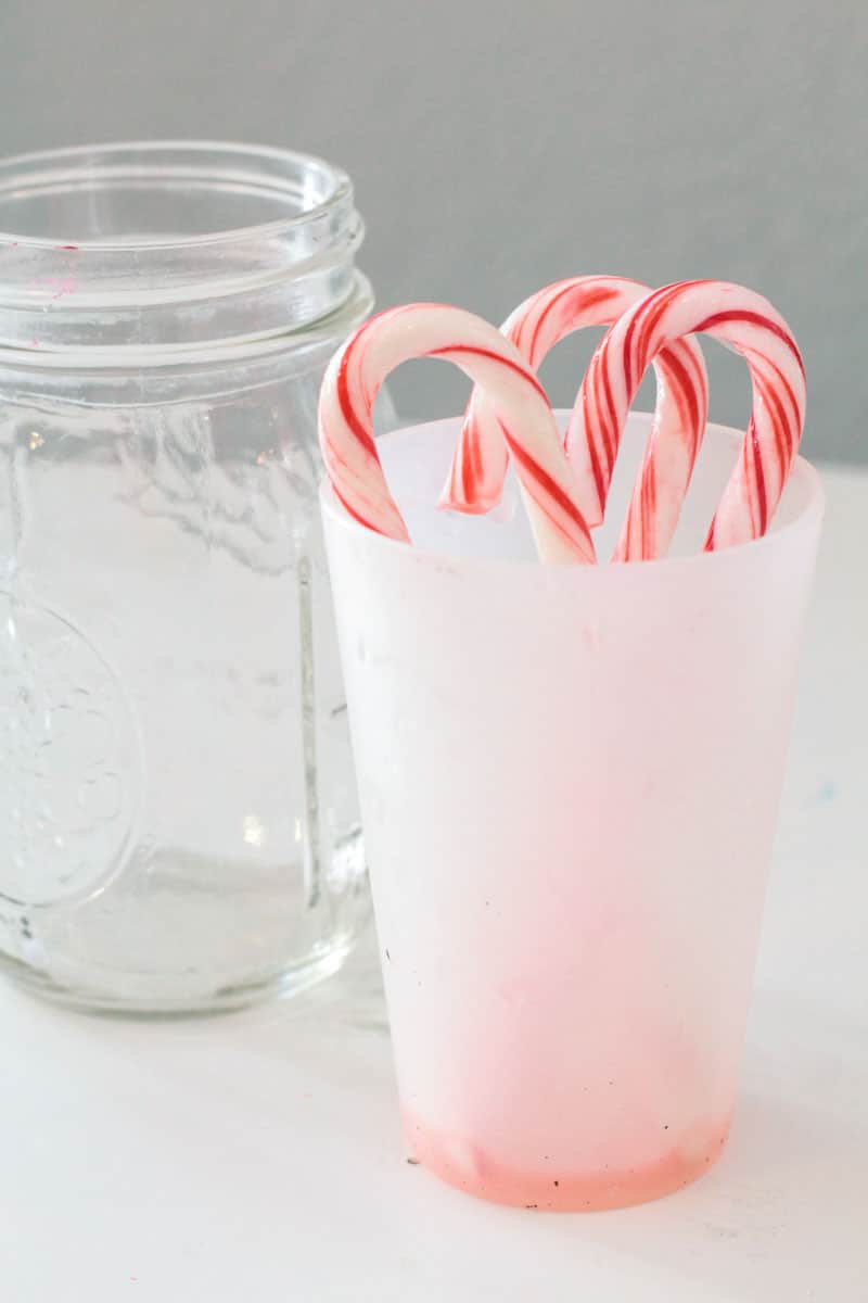 Make science magical in December with fun Christmas science projects, like this dissolving candy cane science experiment. Make science festive!