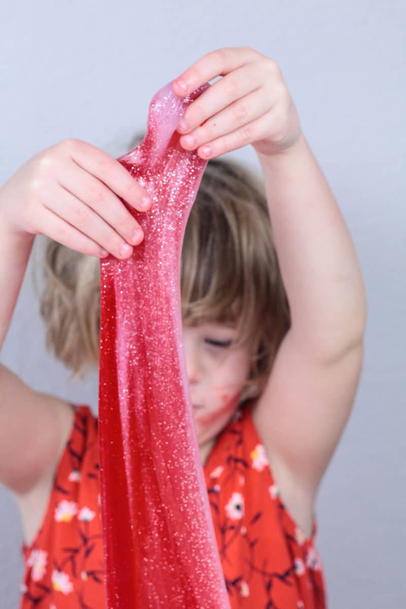 Mix Christmas and science with this fun Christmas STEM activity: making a candy cane slime recipe! Kids will love this hands-on science activity.