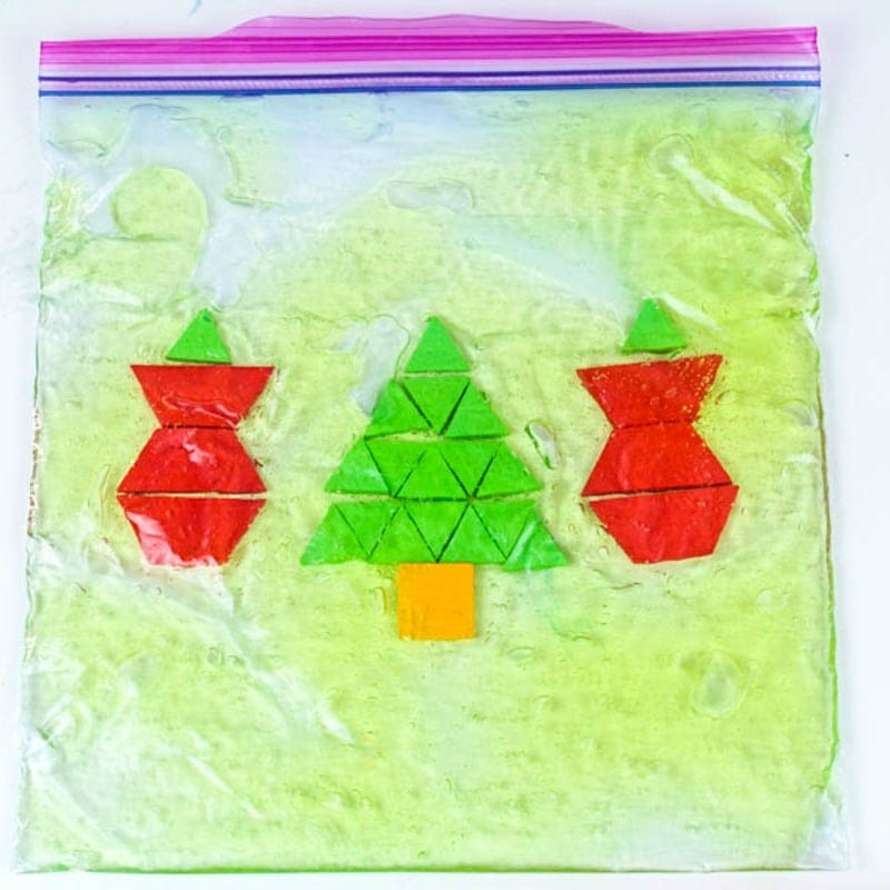 Make Christmas a fun sensory activity and math rolled into one with this Christmas pattern block sensory bag! Preschoolers will love this STEM activity!