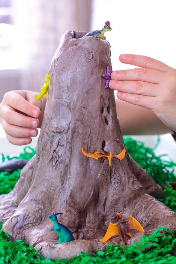 Take slime to the next level! Make volcano slime that really erupts using these easy directions for making dinosaur volcano slime! This volcano slime recipe uses fluffy slime and is perfect for setting up volcano science experiments at a science fair! Make slime educational!