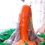 Take slime to the next level! Make volcano slime that really erupts using these easy directions for making dinosaur volcano slime! This volcano slime recipe uses fluffy slime and is perfect for setting up volcano science experiments at a science fair! Make slime educational!