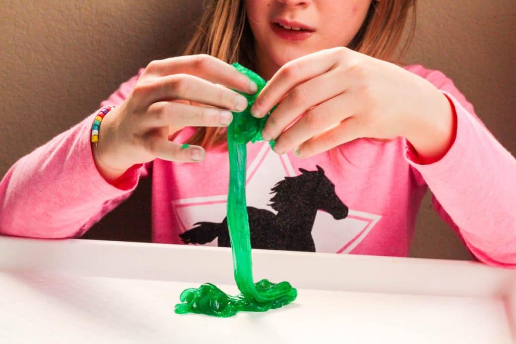 girl playing with slime without borax or liquid starch