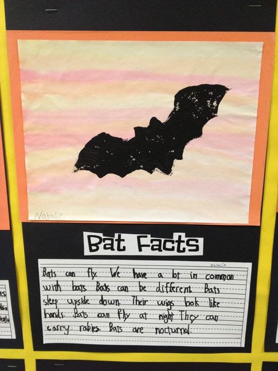 a halloween classroom door decorated with a bat and bat science facts