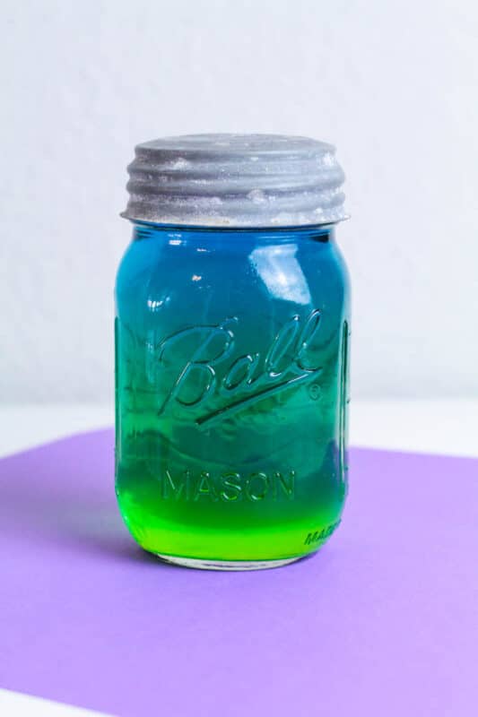 blue and green sugar water science experiment in a jar to look like Fortnite slurp drink