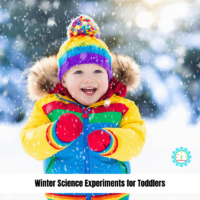 toddler in colorful jacket doing science experiments