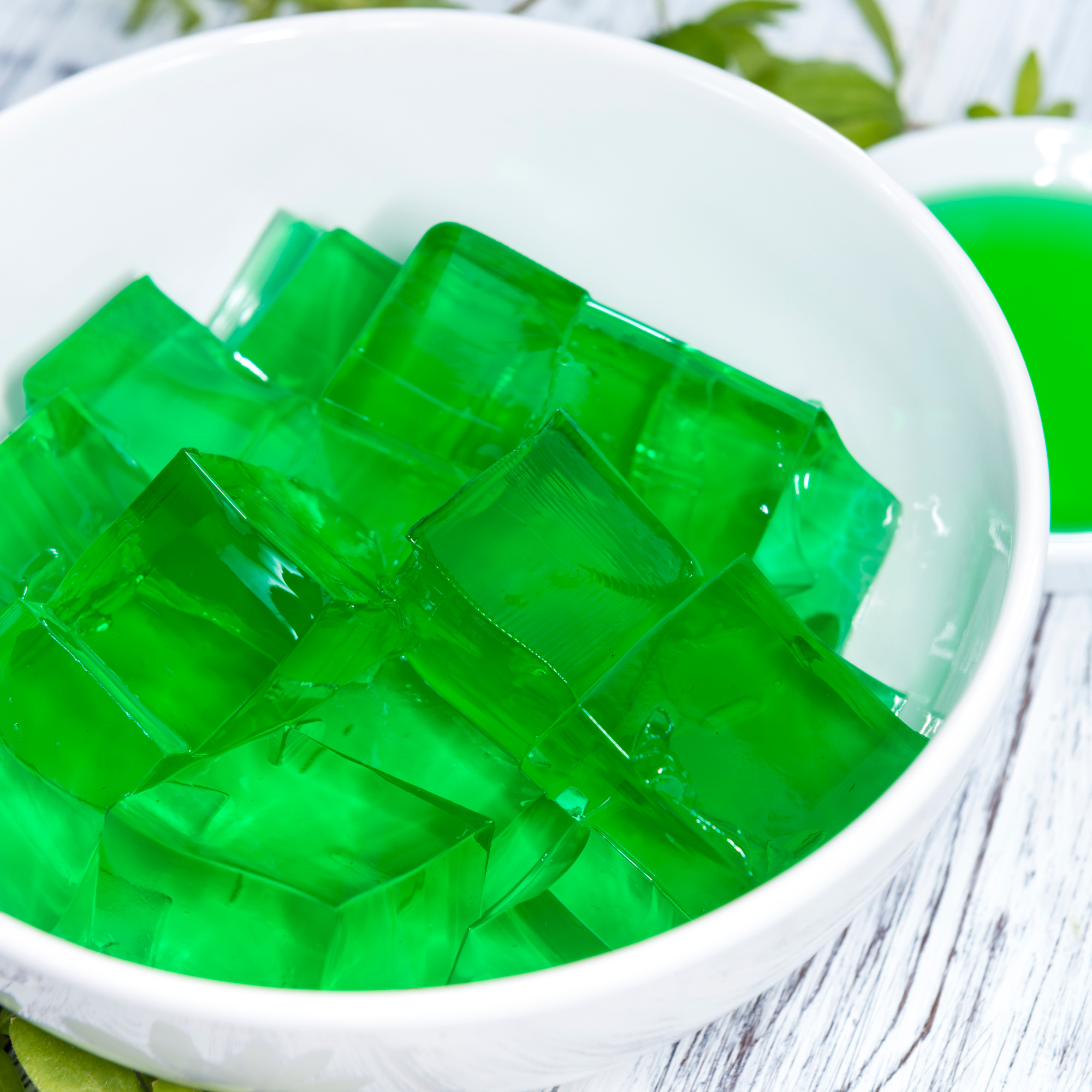 a bowl of green jello